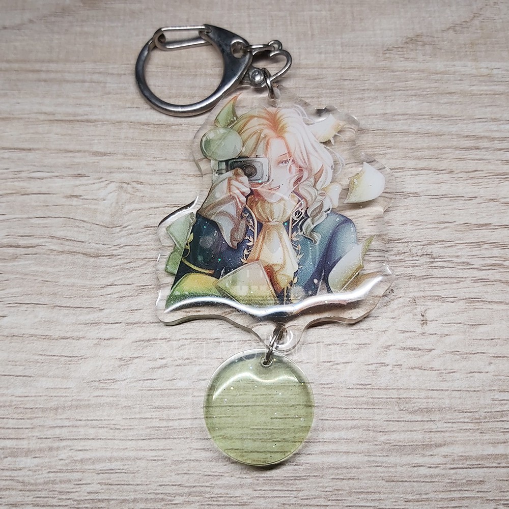 MÓC KHOÁ ACRYLIE PHỦ EPOXY KIM TUYẾN IDV Joseph