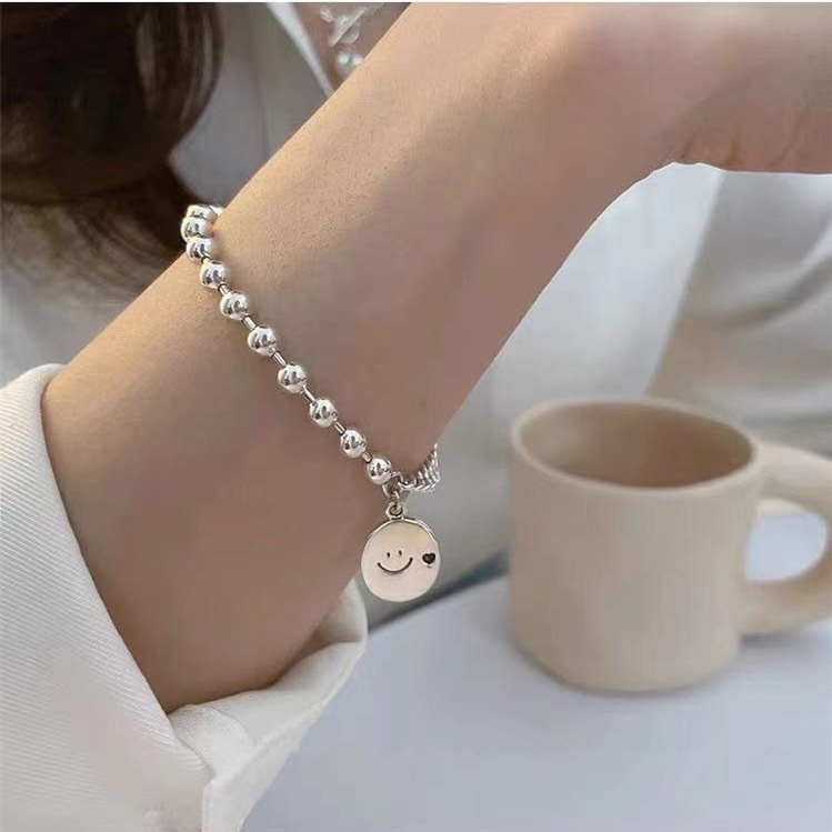 Vòng tay phối hạt giả ngọc trai và hình mặt cười thời trang Hàn Quốc