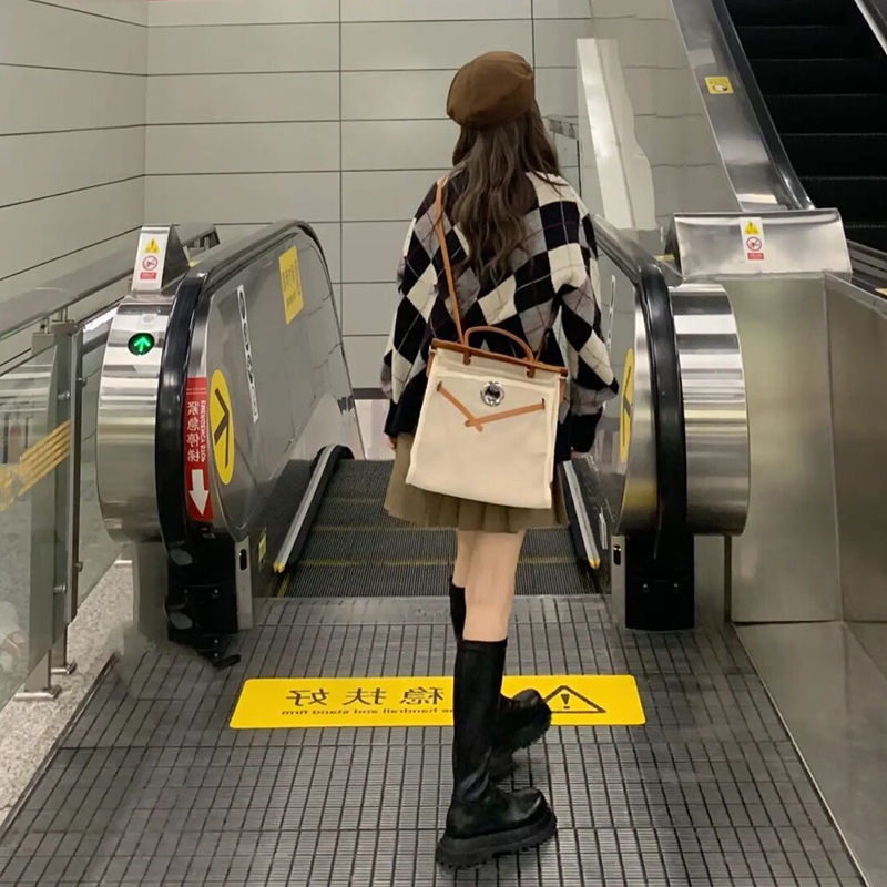 Bộ áo khoác cardigan dệt kim + chân váy xếp ly thời trang thu đông 2021