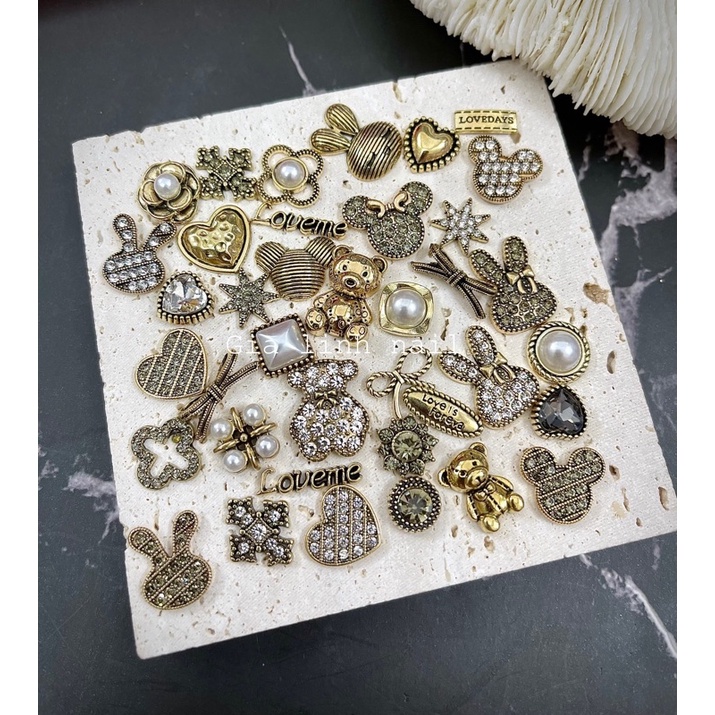 Charm set gấu nơ ( y hình )