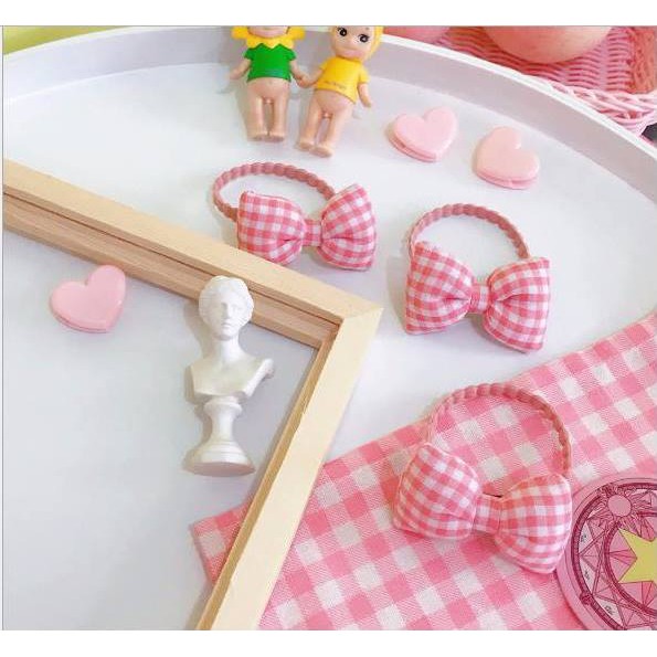 Cột tóc caro vải nơ hồng dễ thương