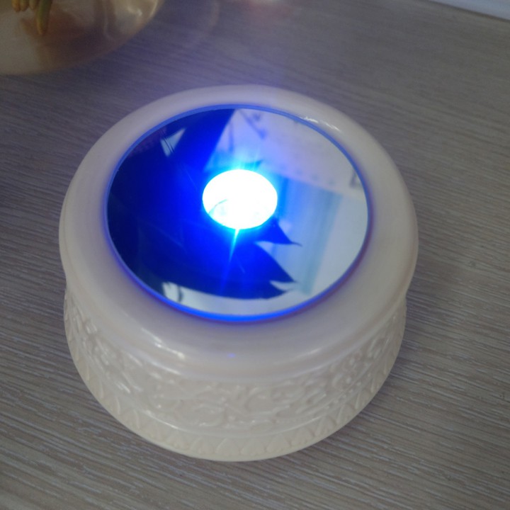 Đế xoay có led dây cót xoay phát nhạc sinh nhật