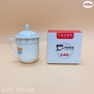 Ly sứ trắng hoa văn có nắp đậy 300ml [hàng siêu thị có tem nhãn].Sứ dày bóng mịn,hoa văn sắc sảo