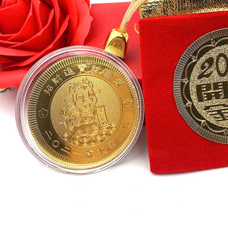Đồng xu vàng xi mạ kỷ niệm năm Tân Sửu 2021 kèm túi vải đỏ cầu may mắn