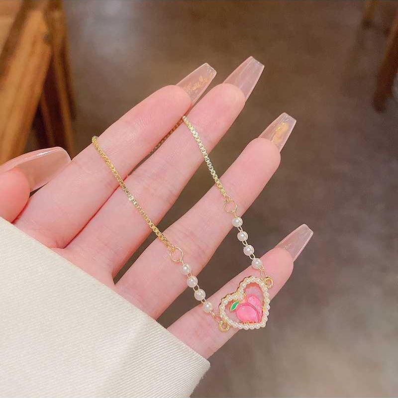 Vòng cổ Ngọc Trai Mặt Trái Tim Đính Đá Pha Lê Hồng