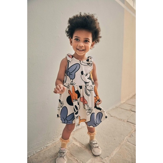 Váy sát nách thắt nơ hoạ tiết Minnie hm cho bé gái màu trắng size từ 12-32 cân