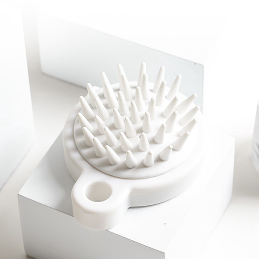 Lược mát xa da đầu mini cầm tay bằng silicon tiện dụng