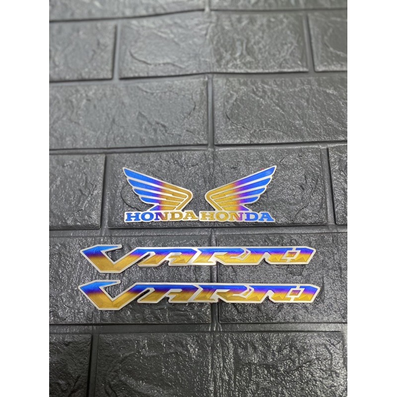 COMBO TEM TITAN CHỮ VARIO 150 VÀ LOGO CÁNH CHIM TITAN ( CAM KẾT TITANIUM THẬT 100%)