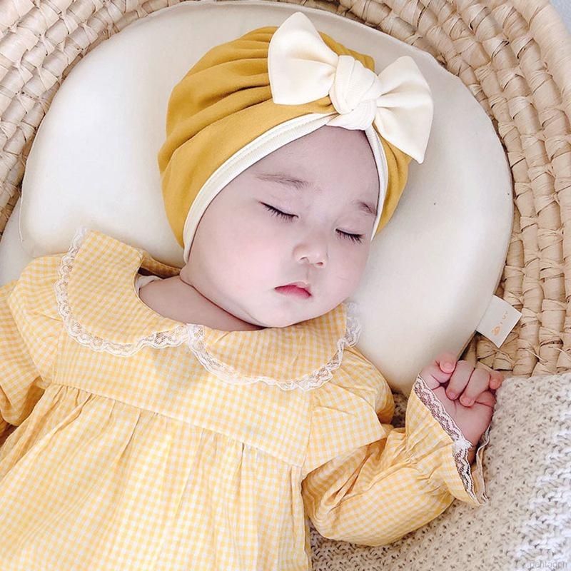 Mũ trùm đầu beanie đính nơ màu trơn đáng yêu dành cho trẻ em