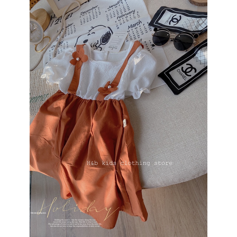 Váy yếm cam 2 bông hoa bé gái