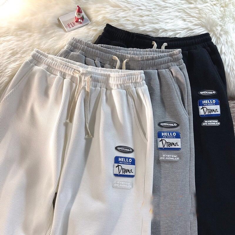 Quần ống rộng jogger unisex in logo, quần jogger dây rút chất tổ ong kiểu dáng thể thao năng động
