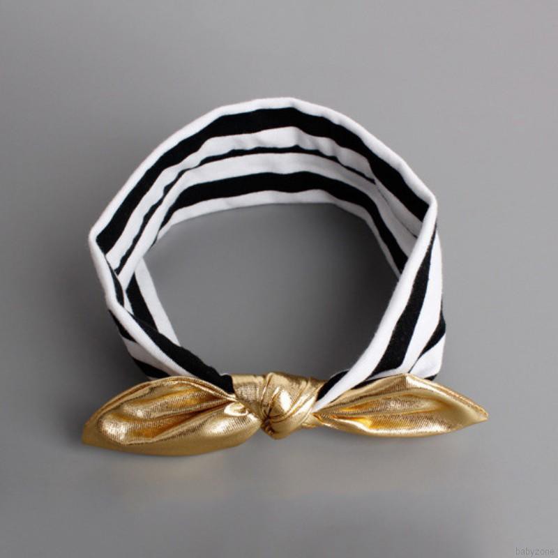 Băng đô vàng đính nơ xinh xắn cho bé gái