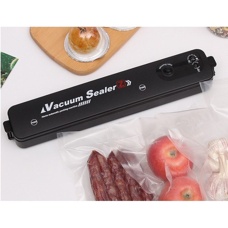 MÁY HÚT CHÂN KHÔNG. Vacuum Sealer  Máy ép chân không giúp thực phẩm tươi lâu hơn.  LƯU Ý: Máy dùng với túi 1 mặt nhám, t