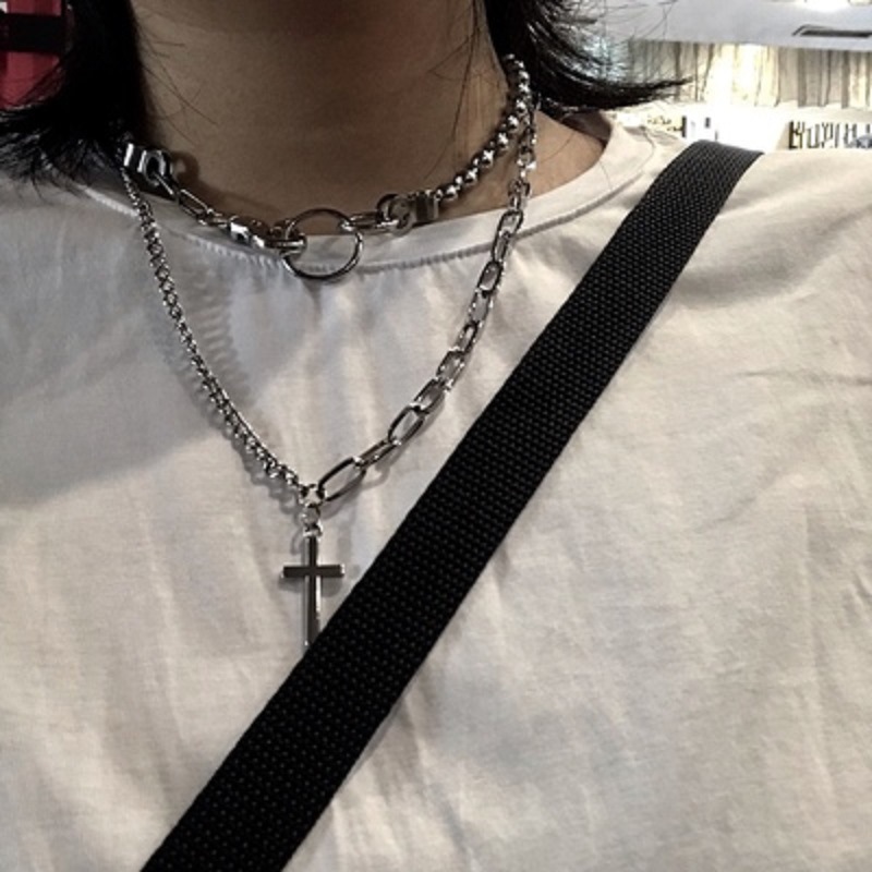  Asymmetrical necklace with cross pendant