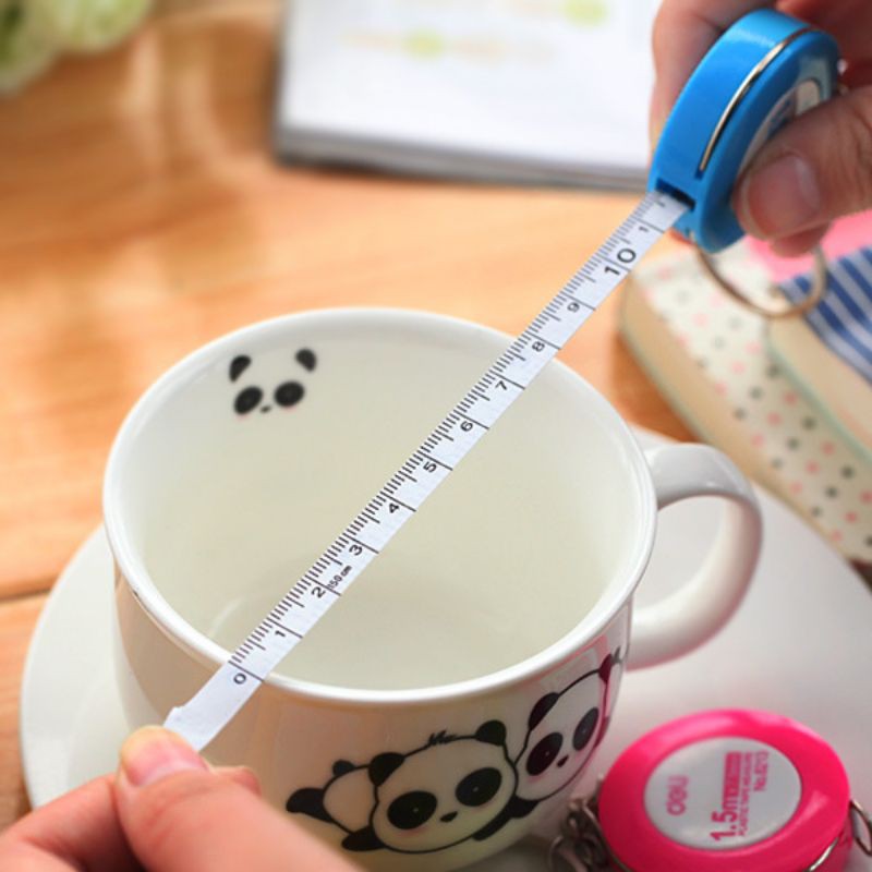 Móc khóa cuộn thước dây hình tron 1.5m Deli,,,