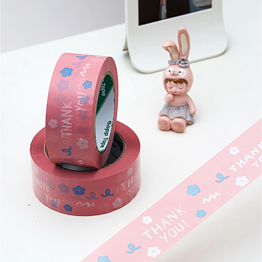 Cuộn băng keo dán đóng gói vận chuyển màu hồng hình chữ Thank You kích thước 4.5cm x 100M