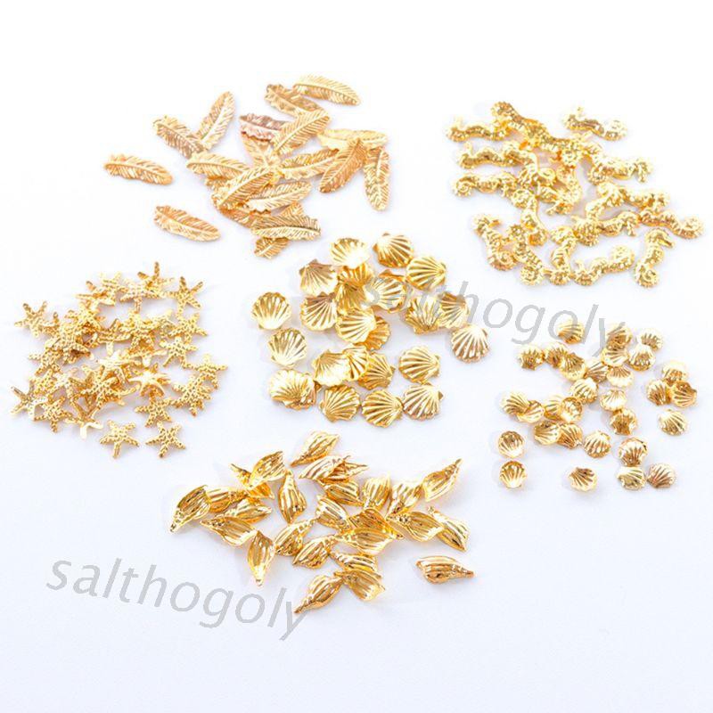 Hộp phụ kiện trang trí móng tay nghệ thuật kim loại kiểu vỏ sò sao biển mặt trời lấp lánh hỗn hợp 12 ngăn