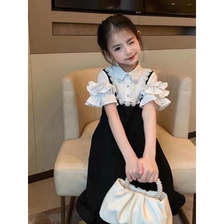 Váy đen phối ngọc bé gái