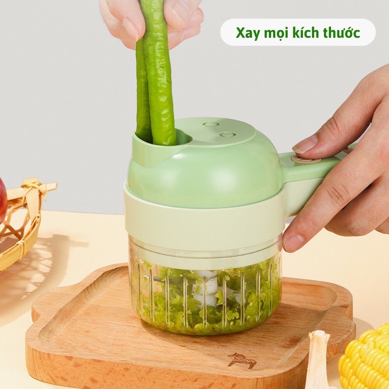 Máy say tỏi cầm tay máy thái rau củ quả.
