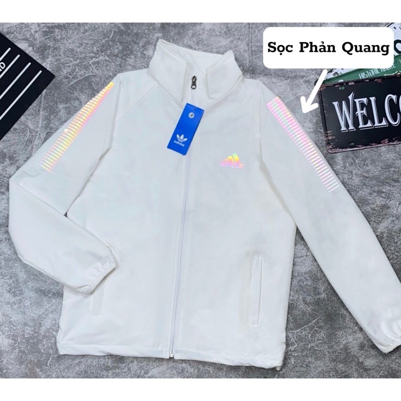 Áo Khoác Gió Nhẹ Nam Nữ 2 Lớp Chống Nắng Màu Trắng Tay Sọc Phản Quang ADIDAS Thể Thao Áo Khoác Dù Nam Nữ Line Có Dây Rút