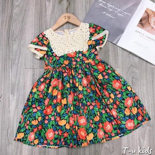 Váy hoa xanh đáp ren ngực bé gái