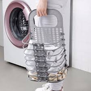 Giỏ nhựa gấp gọn thông minh cài cạnh máy giặt.