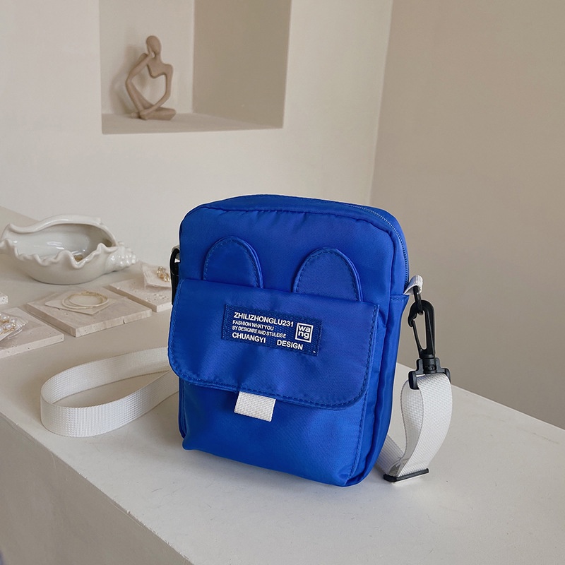 Túi Đeo Chéo Dáng Vuông Nhỏ Chất Liệu Nilon Màu Xanh Dương Mẫu Mới