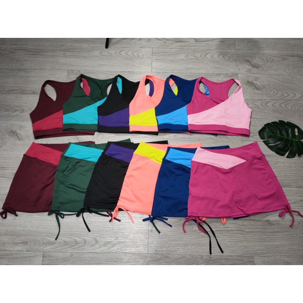 Đồ tập gym nữ, set bộ đùi thể thao phối màu áo bra kèm mút quần đùi váy dây rút Bin Sports BN075