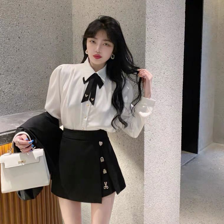 Set áo sơ mi tay phồng thắt nơ + chân váy xẻ tà cạp cao màu đen thời trang mùa xuân cho nữ