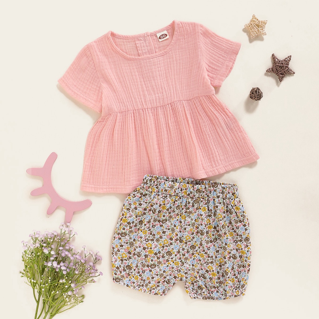 Bộ đồ 2 mảnh MIKRDOO gồm áo tay cộc màu hồng và quần hoa chất liệu vải cotton dành cho bé gái