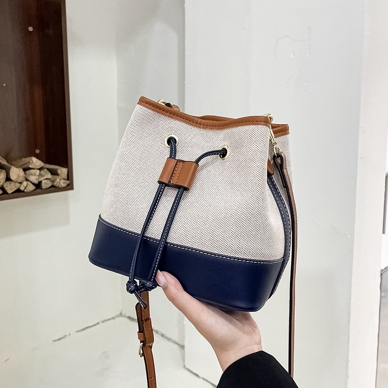 Túi đeo vai canvas kết cấu dạng xô màu sắc tương phản phong cách phương tây 2021 mới thời trang mùa thu nhỏ gọn cho nữ