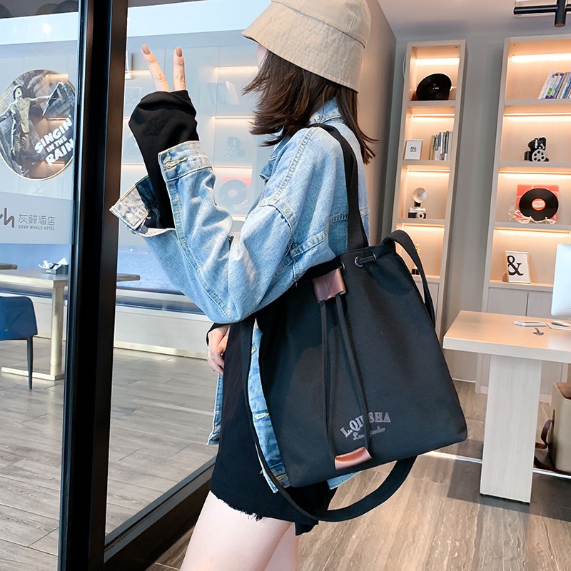 Túi Đeo Vai Vải Canvas Dây Rút Sức Chứa Lớn Mẫu Mới Dễ Phối Đồ Cho Nữ Sinh