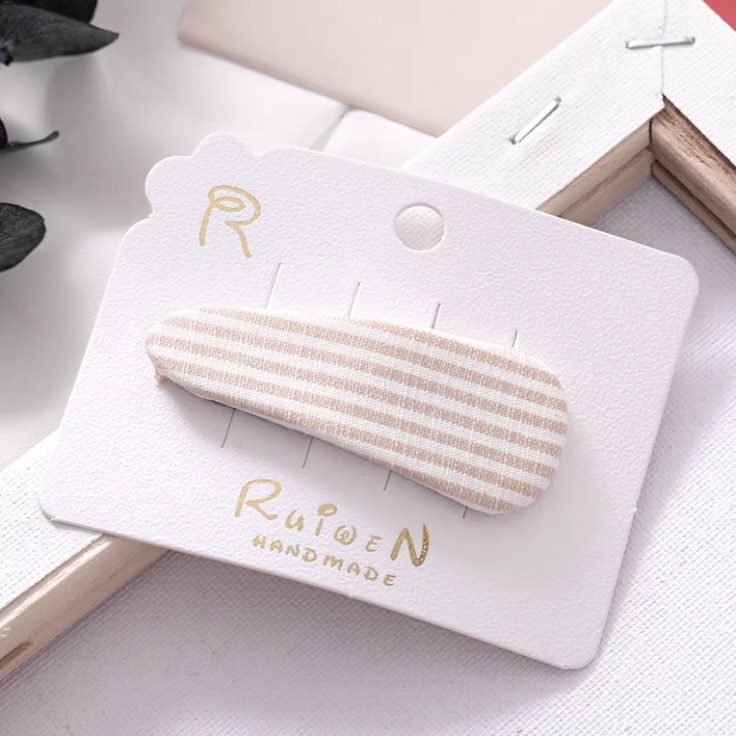 Kẹp tóc dài họa tiết chấm bi và kẻ cho bé gái