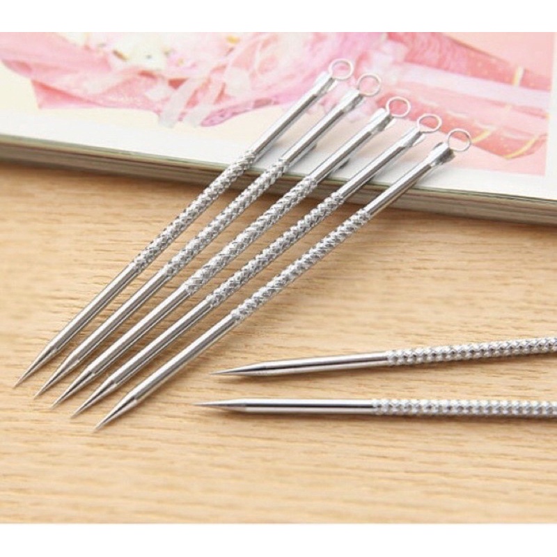 Que nặn mụn 2 đầu