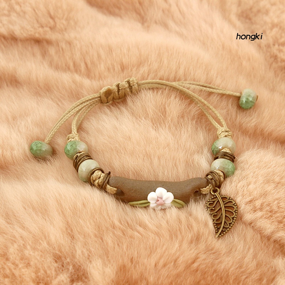 Vòng tay dây bện mặt hình hoa lá thời trang dành cho nữ