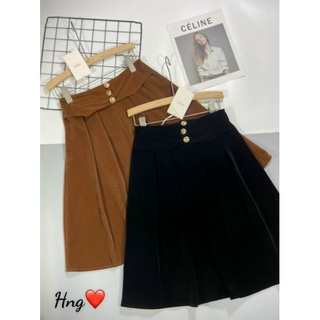 Chân váy nhung xếp ly xoè dài tới gối