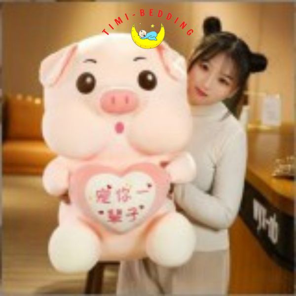 Gấu bông lợn hồng ôm trái tim cute, ngộ nghĩnh đáng yêu – Gấu bông hình con heo - Timibedding