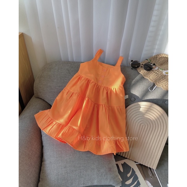 Váy vàng cam xoè tầng cho bé gái