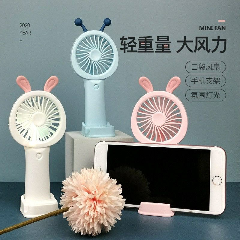 Quạt cầm tay mini có giá để điện thoại.