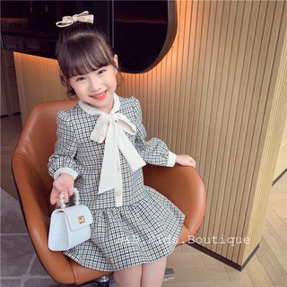 Váy kẻ cổ nơ đuôi cá bé gái