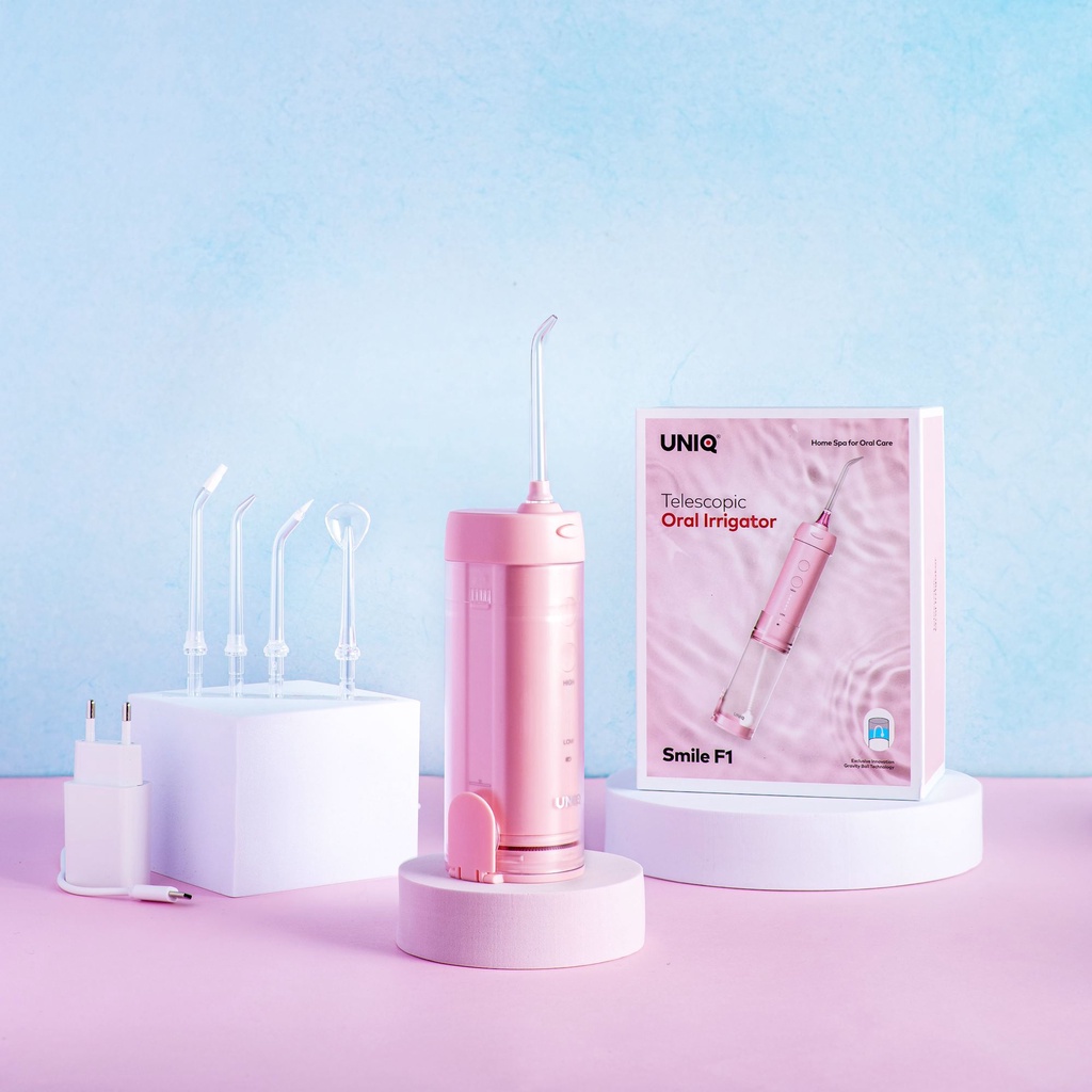 Máy tăm nước mini chính hãng UNIQ Smile F1 Nhật Bản cao cấp bóng trọng lực Gravity cầm tay trắng hồng