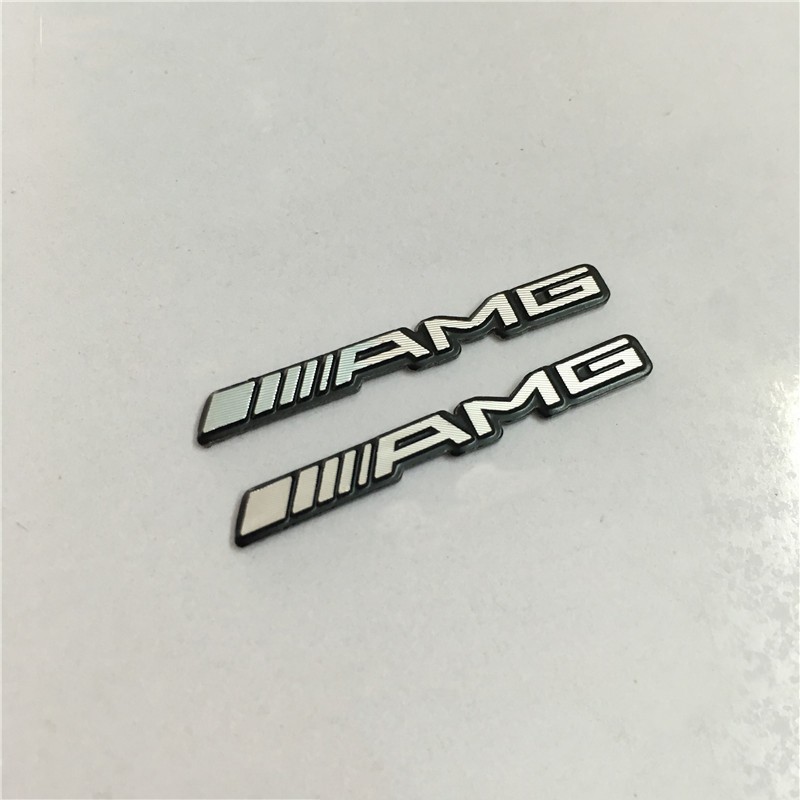 Set 2 logo AMG dán vô lăng xe hơi Mercedes