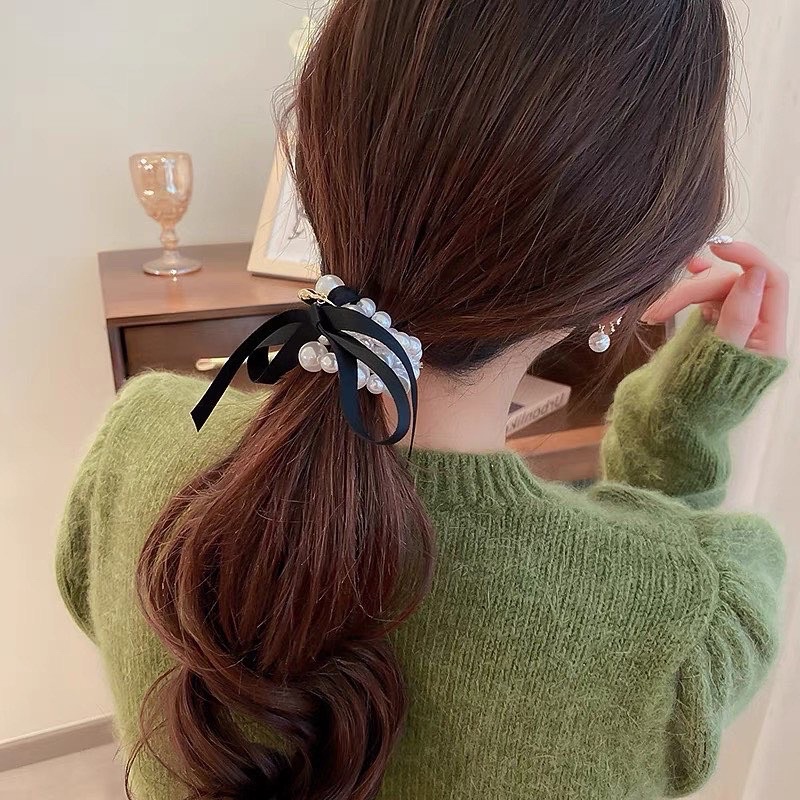 Cột tóc nơ ngọc charm tim