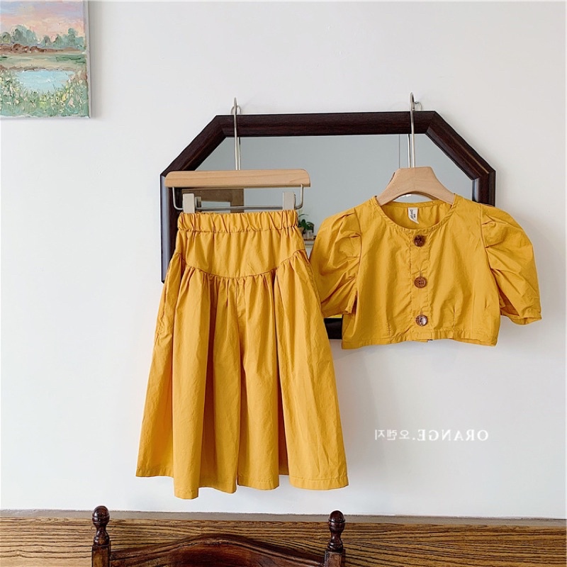 Váy bé gái phong cách Âu màu vàng