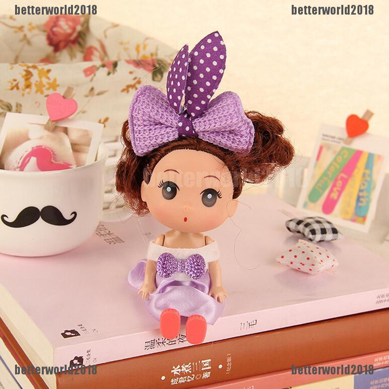 Búp bê mini hình cô bé tóc xù đeo nơ thời trang chiều cao 12cm