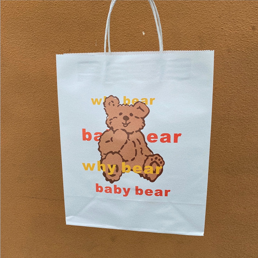 Túi giấy kraft trắng logo hình gấu 27*32*12cm, có quai xách giấy quấn