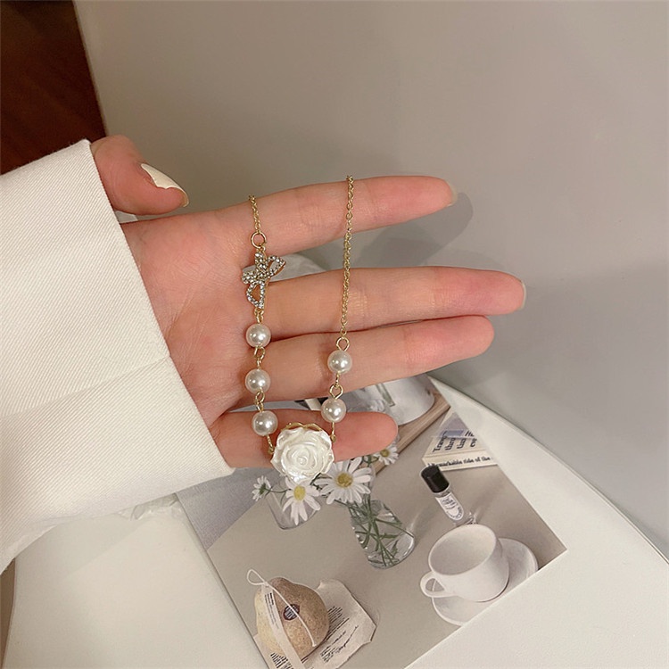 Vòng cổ choker hạt trai mặt hoa hồng và cánh bướm VC009 Leous Accessories