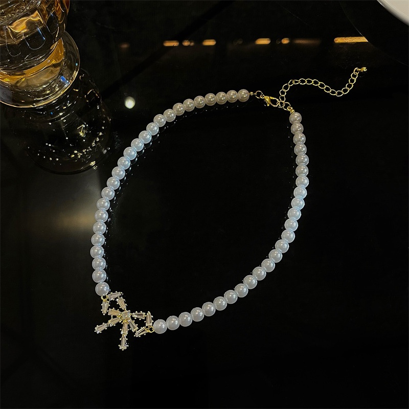 dây chuyền choker nữ chuỗi ngọc đính nơ sáng lấp lánh