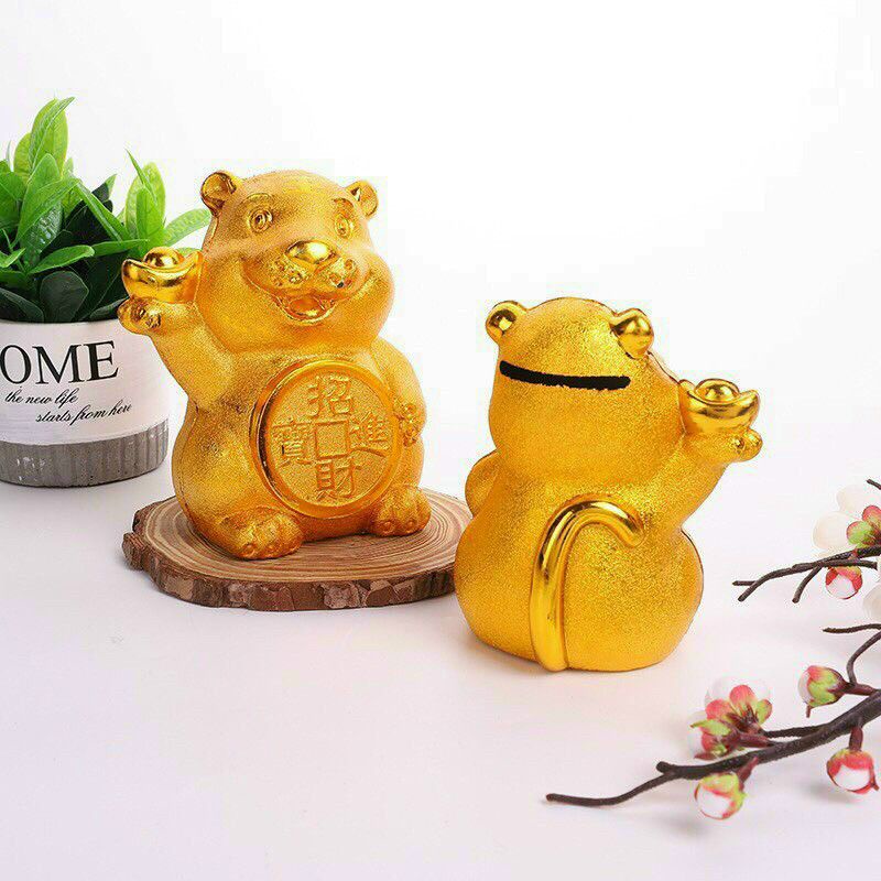 Con heo vàng đựng tiên  tiết kiệm.