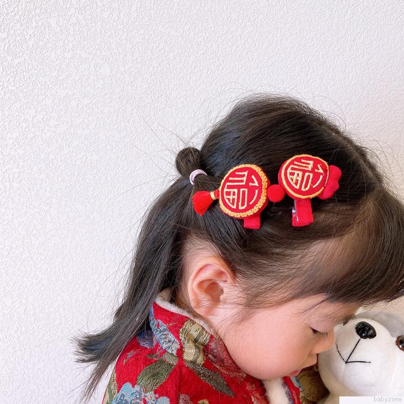 Phụ kiện tóc mừng ngày Tết phong cách ngọt ngào dành cho bé gái